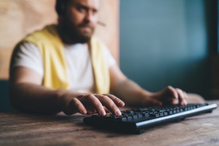 Focused man playing computer game